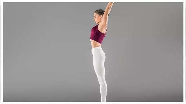 Woman in yoga pose demonstrating calorie burning through yoga