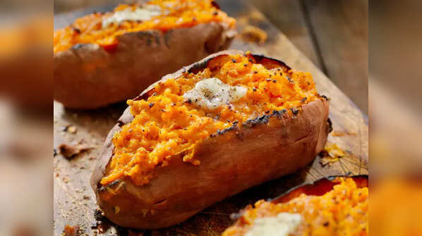 Pile of vibrant sweet potatoes.