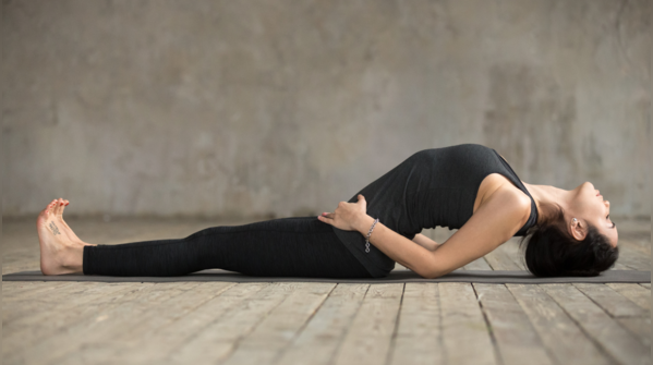 Practicing Matsyasana to stretch the throat