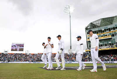England's captain, Ben Stokes, leading his team onto the field.