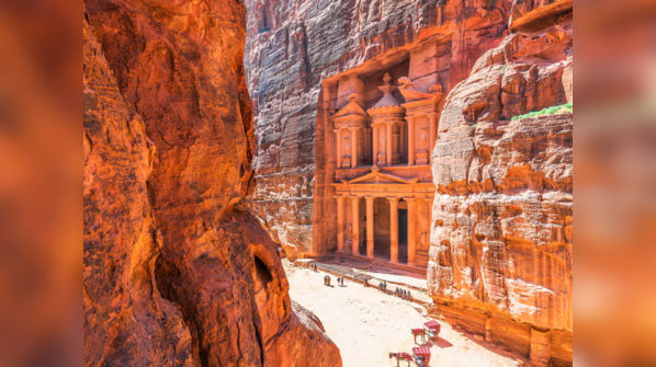 The Treasury at Petra carved into sandstone cliffs.
