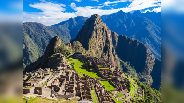 Overview of Machu Picchu nestled in the Andes Mountains.