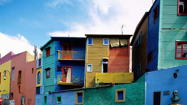 Colorful streets of Buenos Aires, Argentina, with tango dancers.