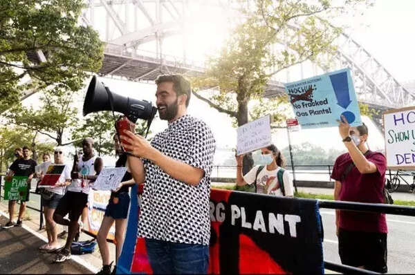 Mamdani advocates against a gas plant in a smart casual ensemble