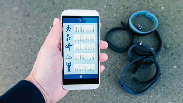 Worried person looking at a fitness tracker