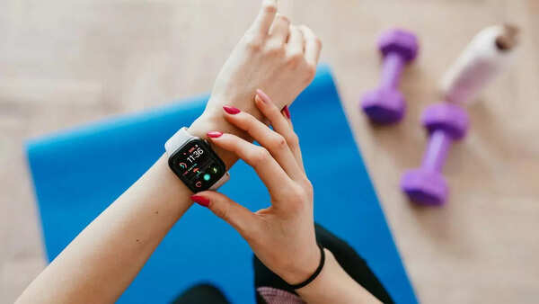 Person using a fitness tracker to monitor heart rate